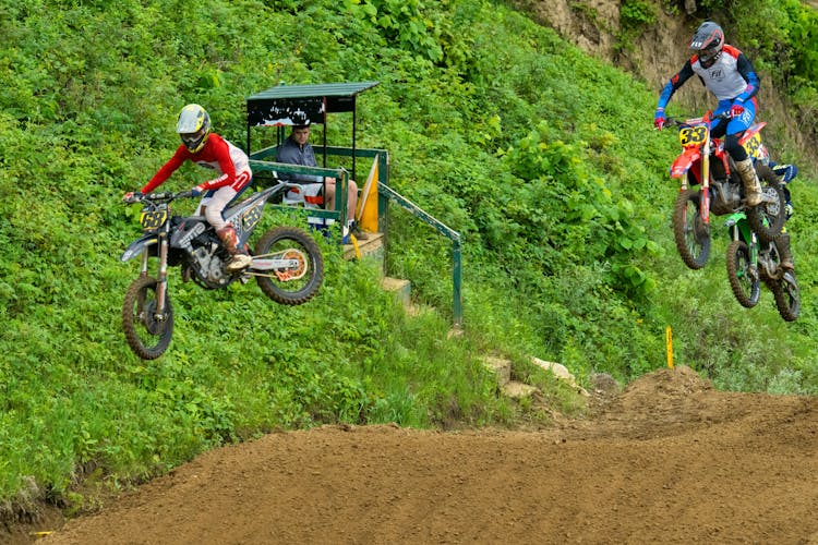 Sportsmen Racing On Motorbikes During Motorcross 