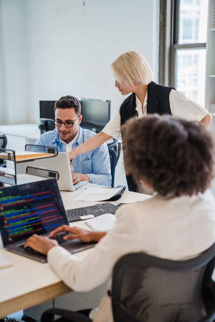Business team reviewing software vendor options on a laptop