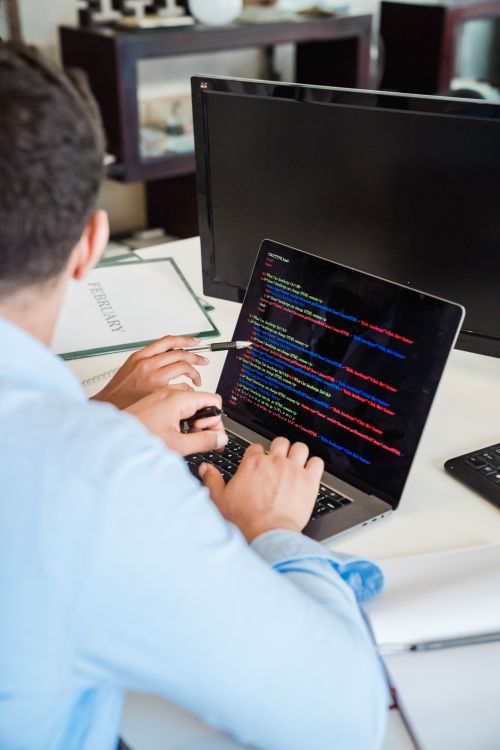 Office Worker Using a Computer in an Office · Free Stock Photo