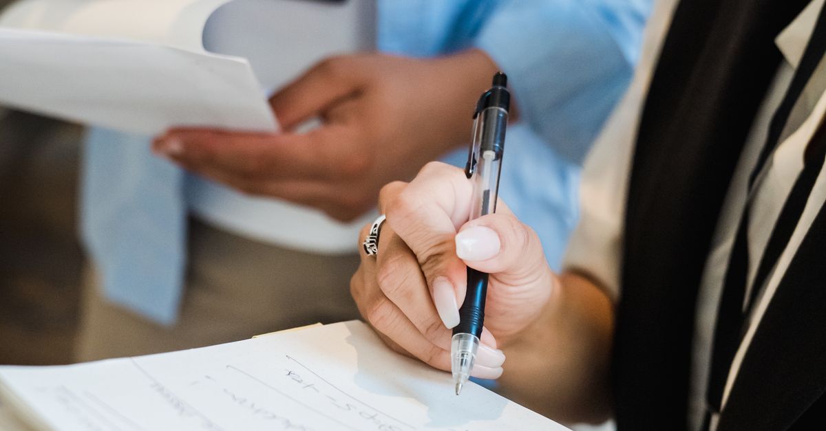 Notes In Office Office Workers Taking Notes in an Office · Free Stock Photo