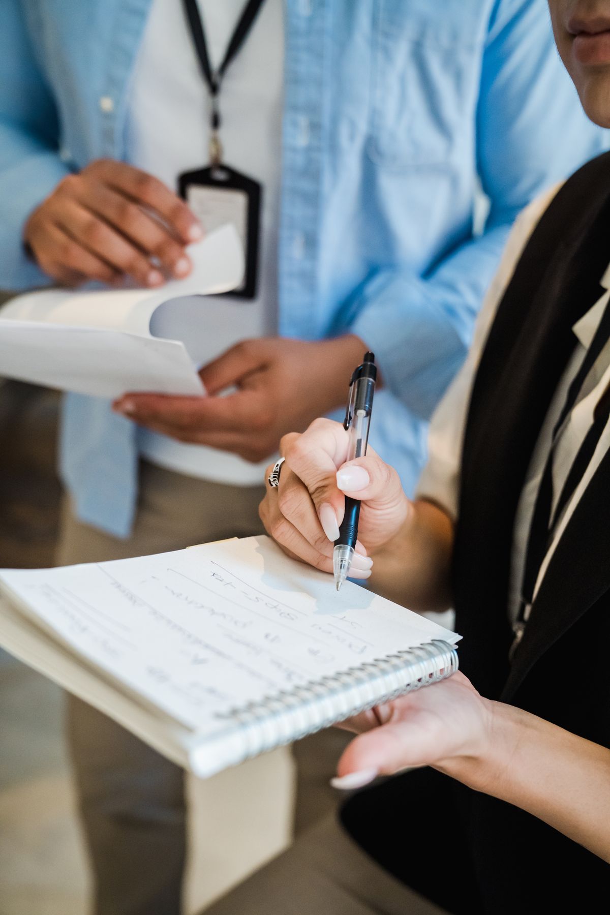 Office workers taking notes in an office