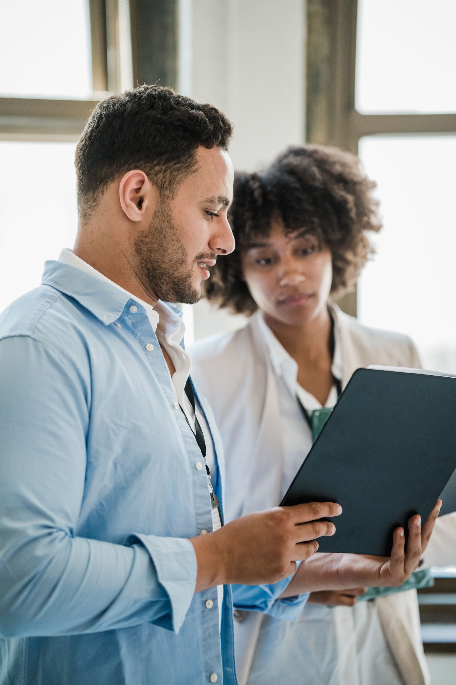 Two colleagues looking at a tablet together