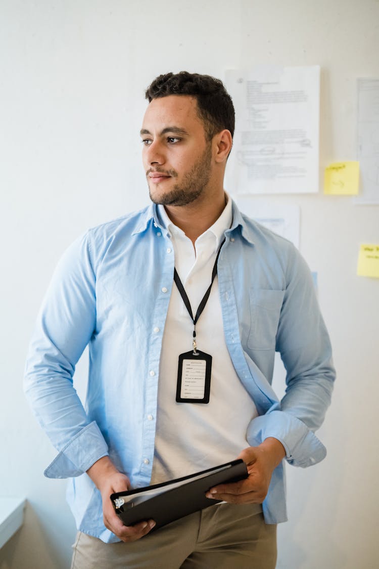 Office Workers With A Document Folder And A Badge 