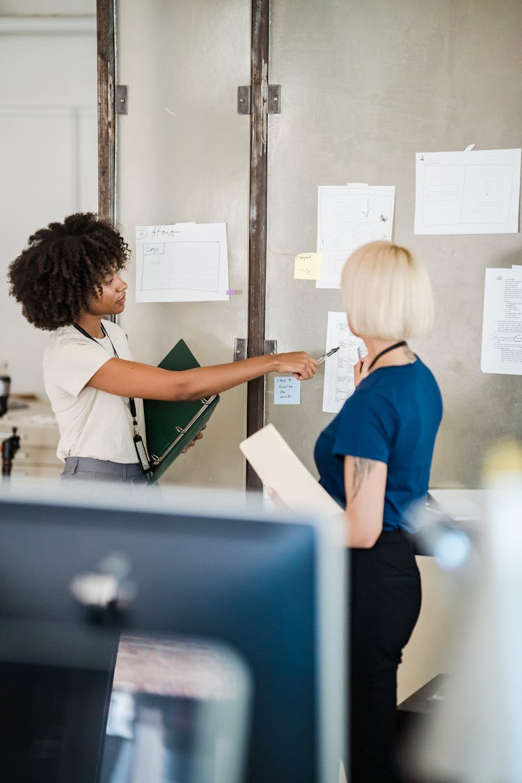 Women Discussing Work Plan In Office 