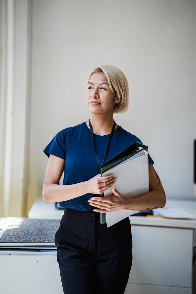 Portrait Of Woman In Office Holding Files