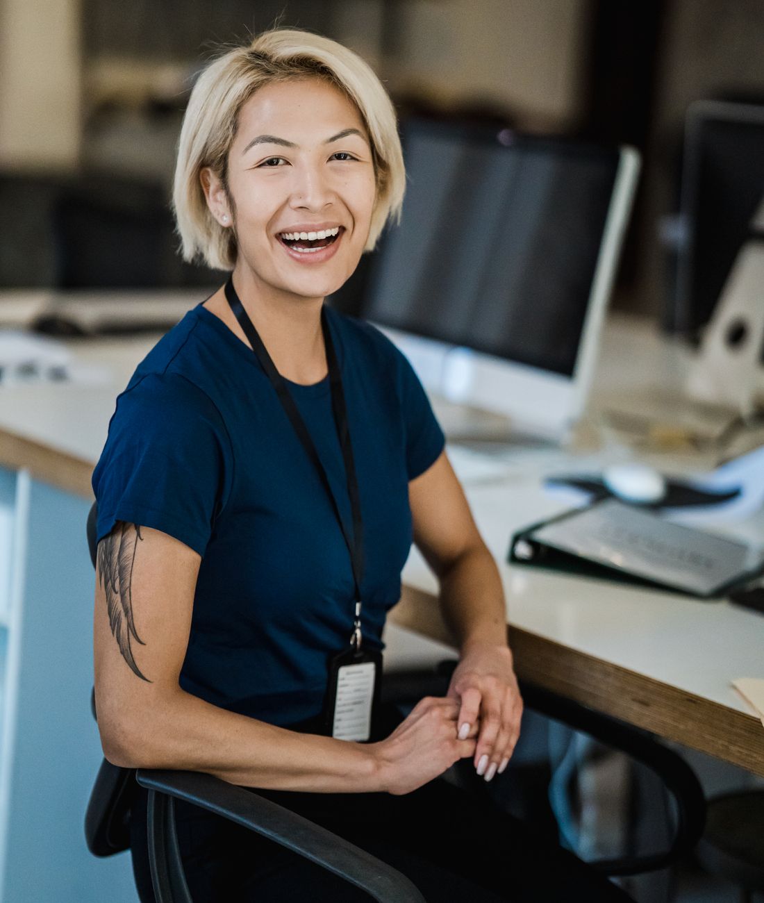A CFM Group team member smiling in the office