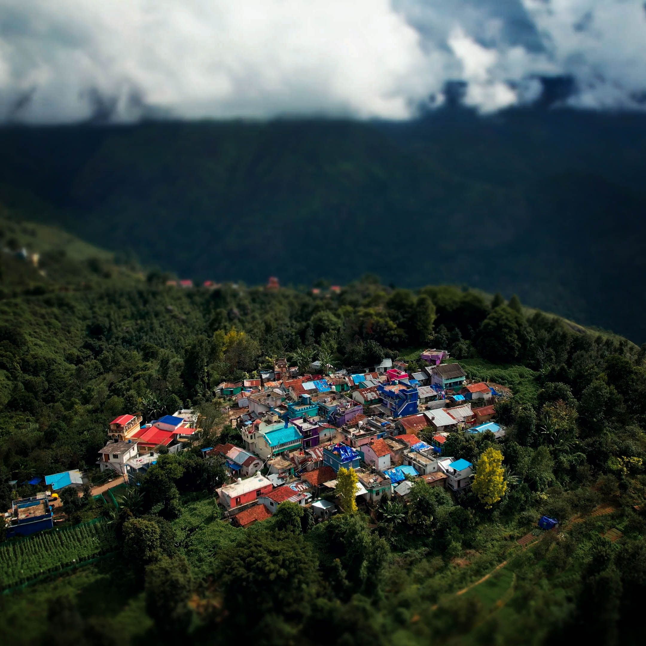 Aerial View of a Village on Mountain Surrounded with Green Trees · Free ...
