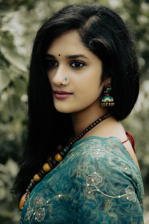 A Woman in Blue Floral Top with Bindi