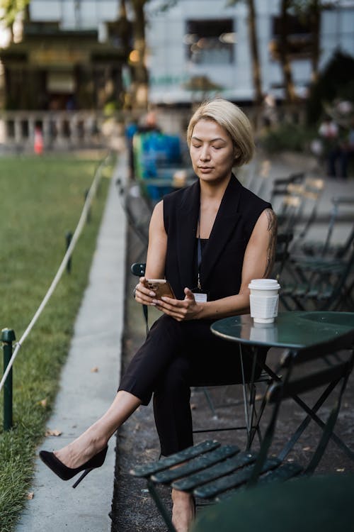 Businesswoman Relaxing on Coffee Break Outdoors