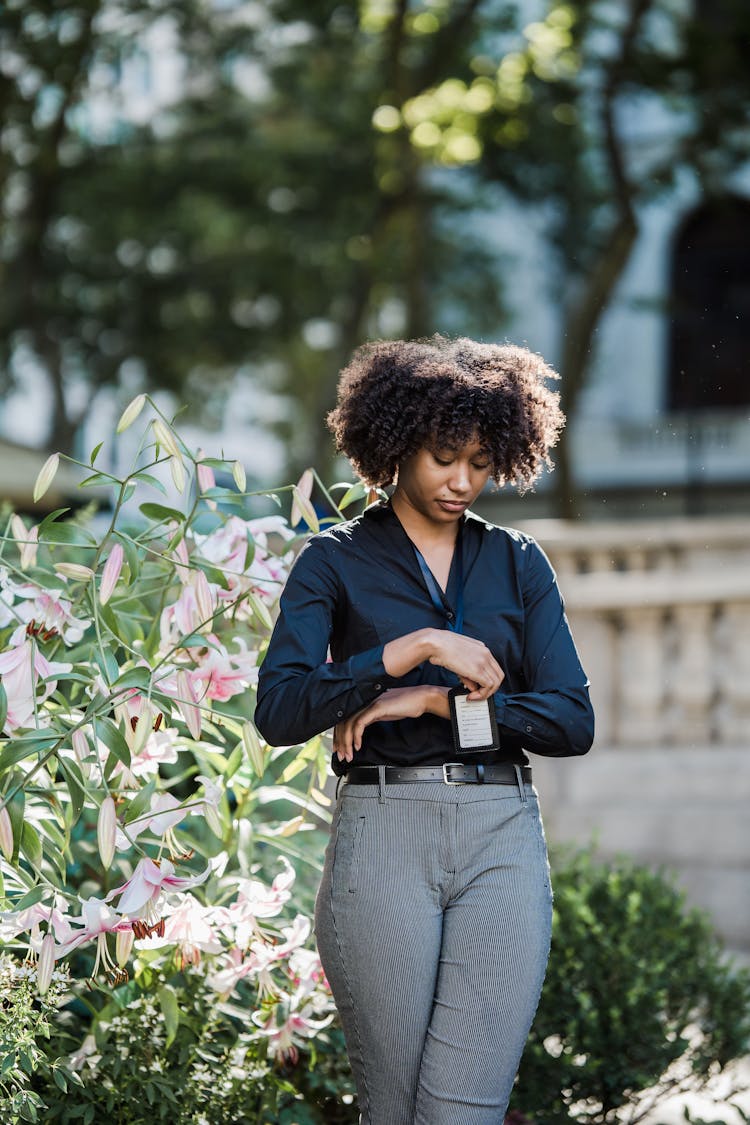 Employee With Badge Standing Outdoors 