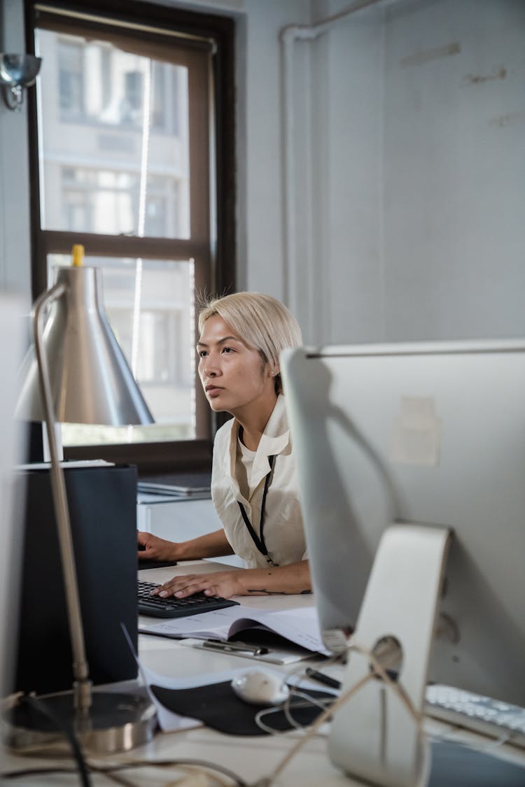 Serious Woman Busy Working On Computer 