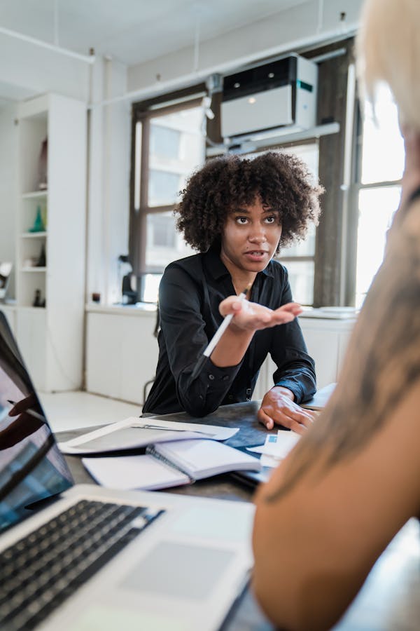 Woman talking and explaining in an office setting