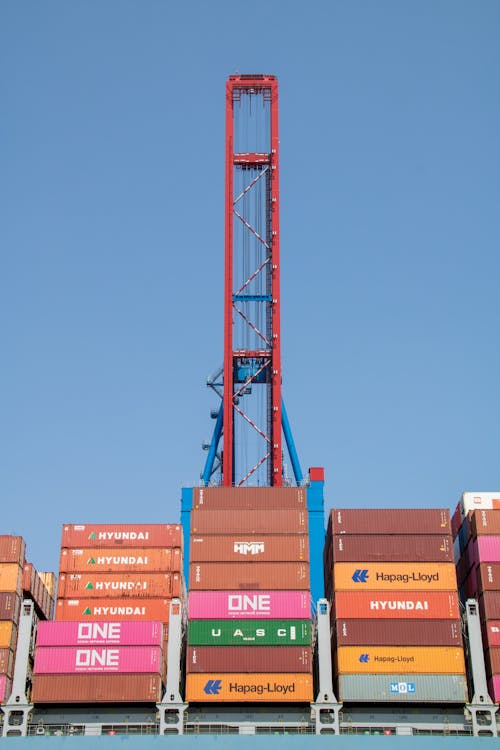 Harbor Crane Over a Pile of Shipping Containers