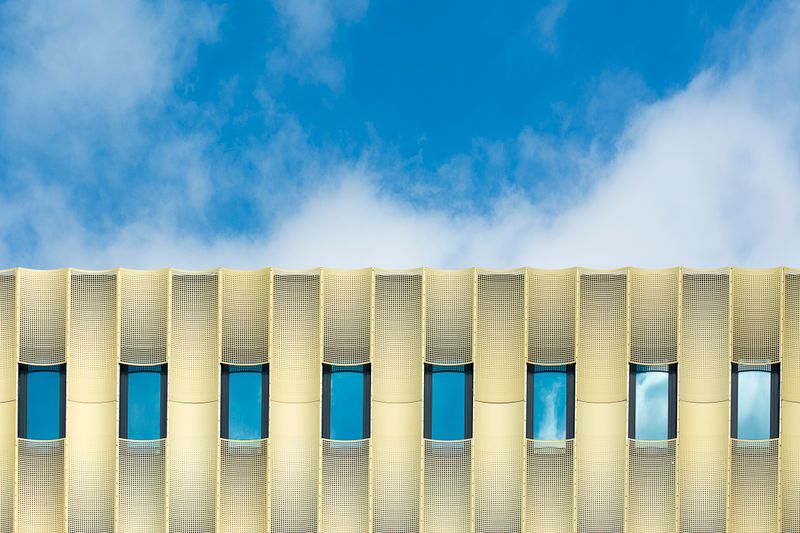 Modern glass office facade — photo by Jan van der Wolf on Pexels