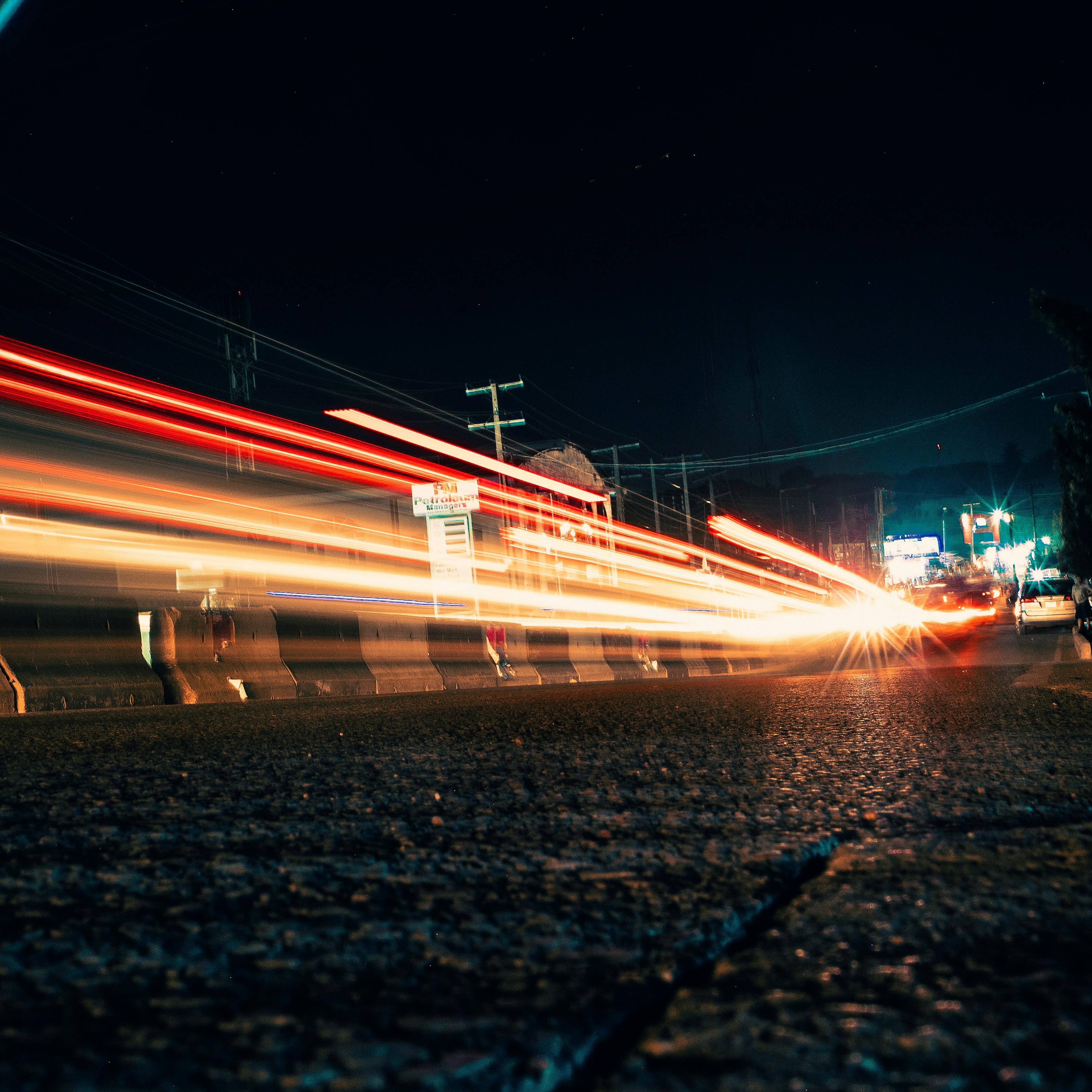 Long exposure of vibrant car lights on a Lagos street at night.