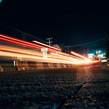 Long exposure of vibrant car lights on a Lagos street at night.