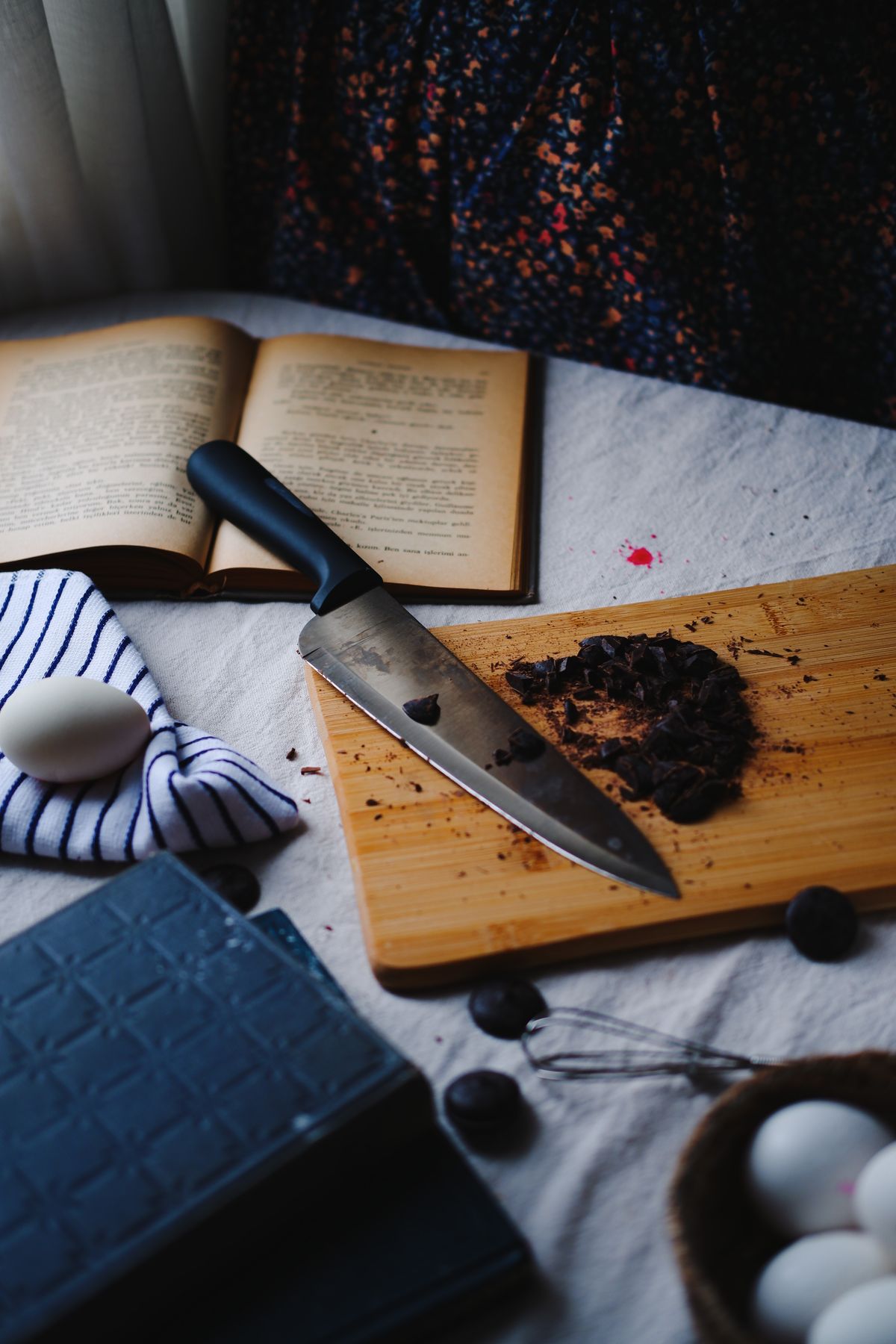 Kitchen knife and cutting board arranged with ingredients for everyday food preparation