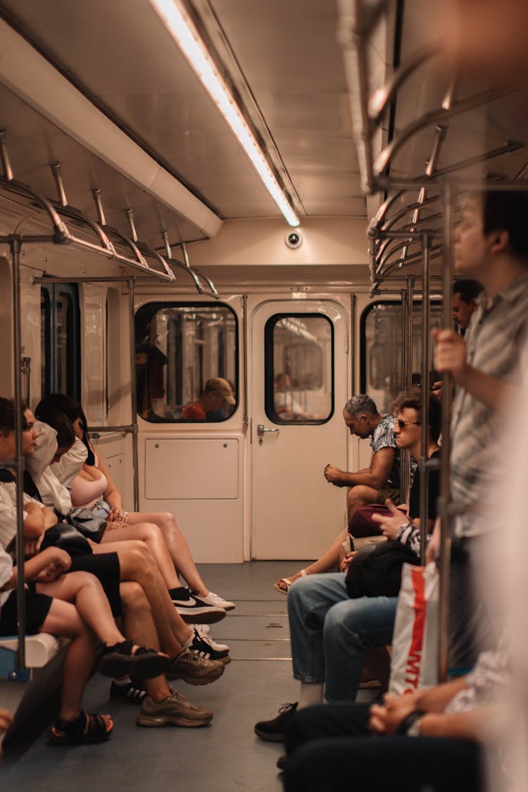 People Sitting Inside A Train