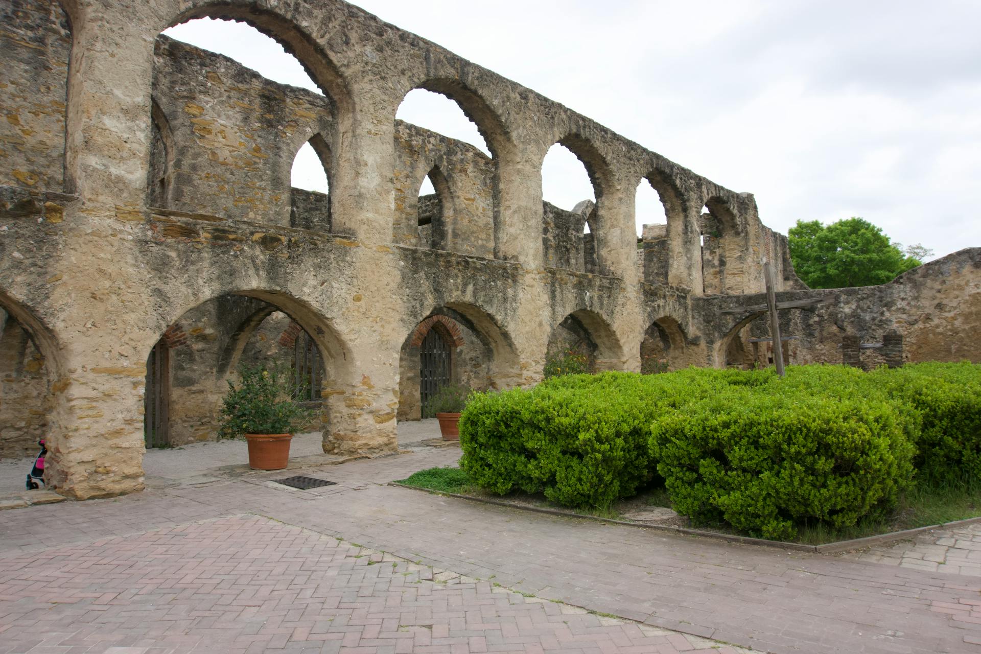 Explore the historic arched stone facade at San Antonio Missions National Historical Park.