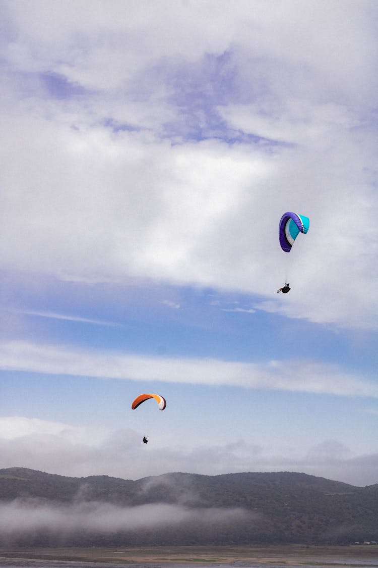 Two Skydivers On Parachutes