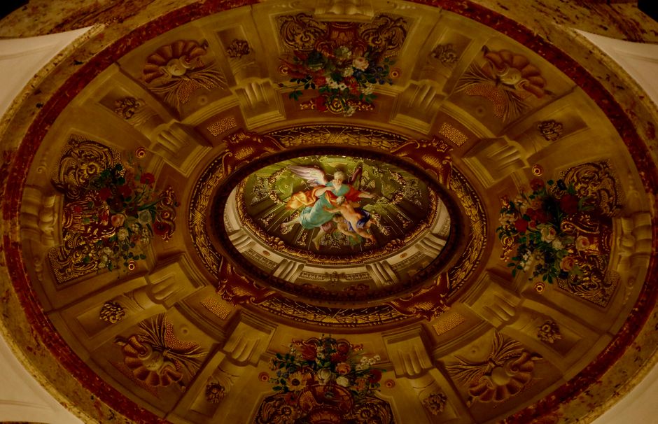 A beautiful interior of a traditional Viennese Kaffeehaus with a Melange coffee