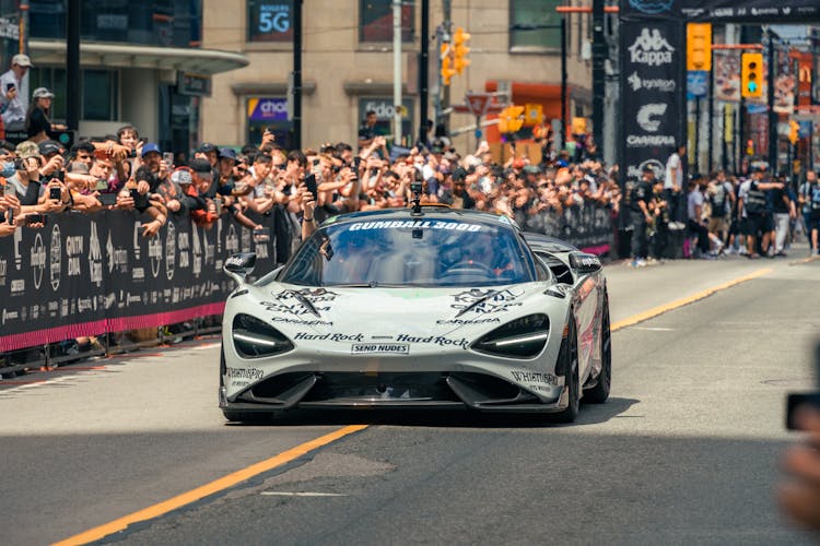 Racecar Driving Down The Road