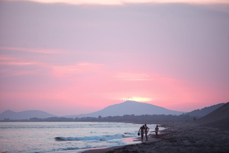 People On The Beach During Sunset