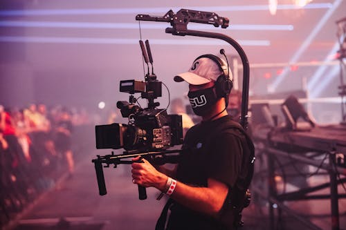 Photo of Camera Man Shooting a Video