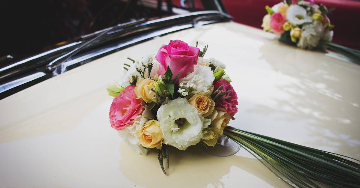 Pink Green and White Flower Bouquet on Beige Car