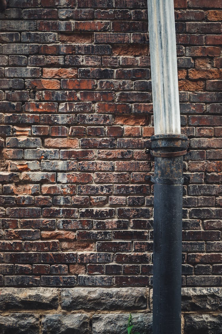 Metal Pipe On Brickwall