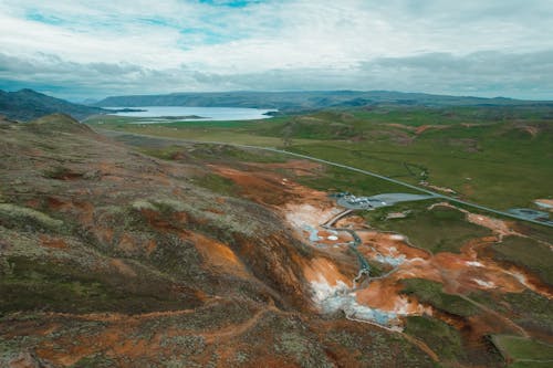 Aerial Photography of Mountains under the Cloudy Sky