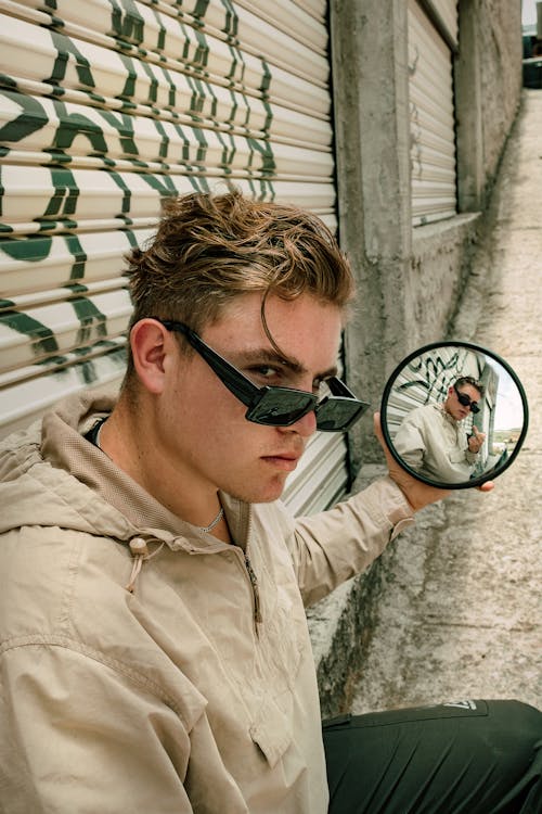 Man in Brown Button Up Shirt Wearing Black Sunglasses