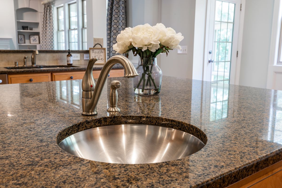quartz vs granite worktops uk — One Is Grown, One Is Made