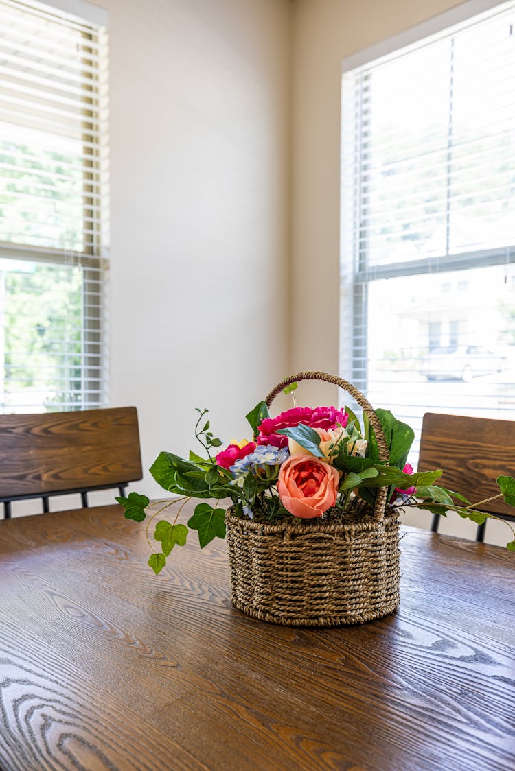 Basket With Flowers On Table