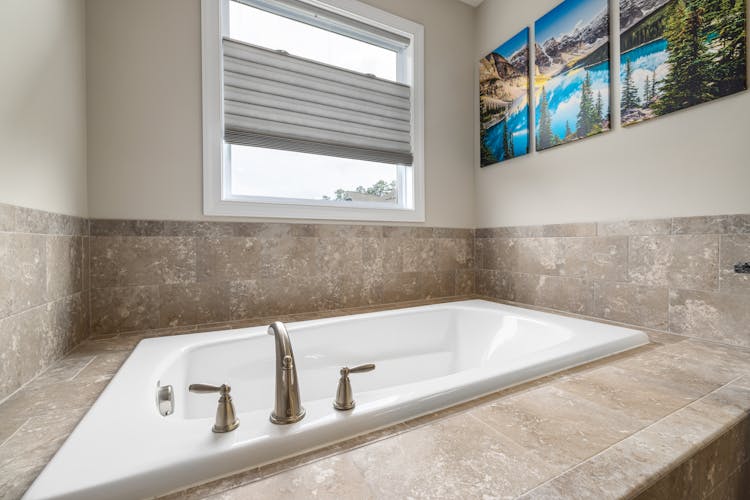 Photo Of Bathtub Near Window