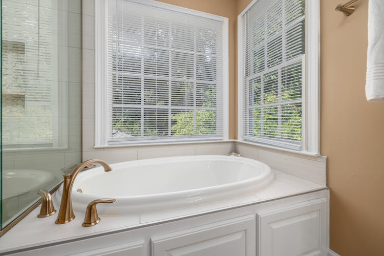 Photo Of Bathtub Near Windows