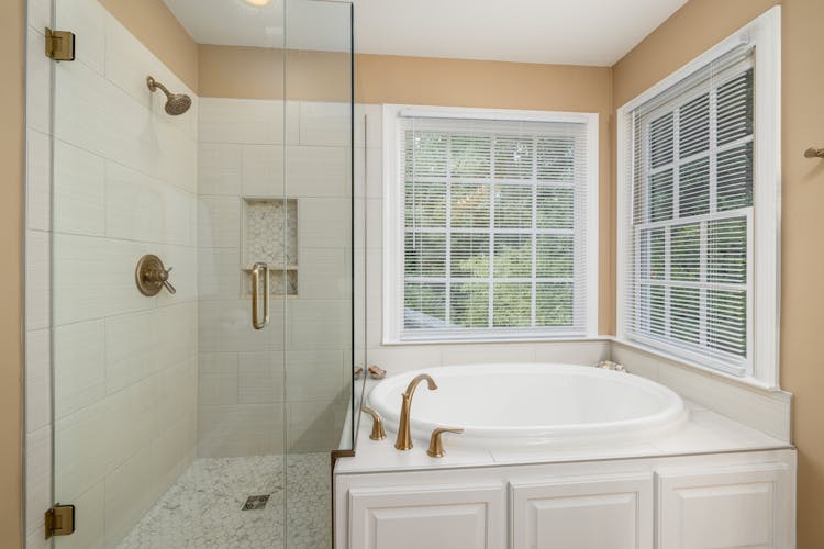 Photo Of Bathtub Near Windows