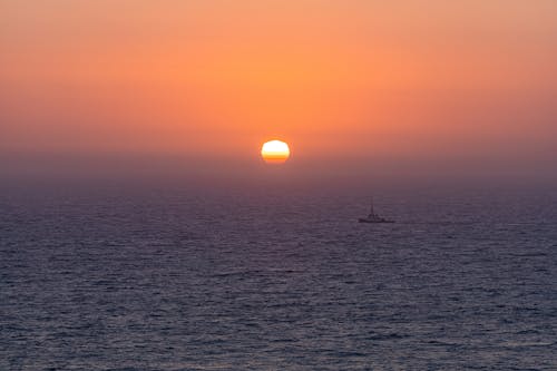Boat on Sea during Sunset