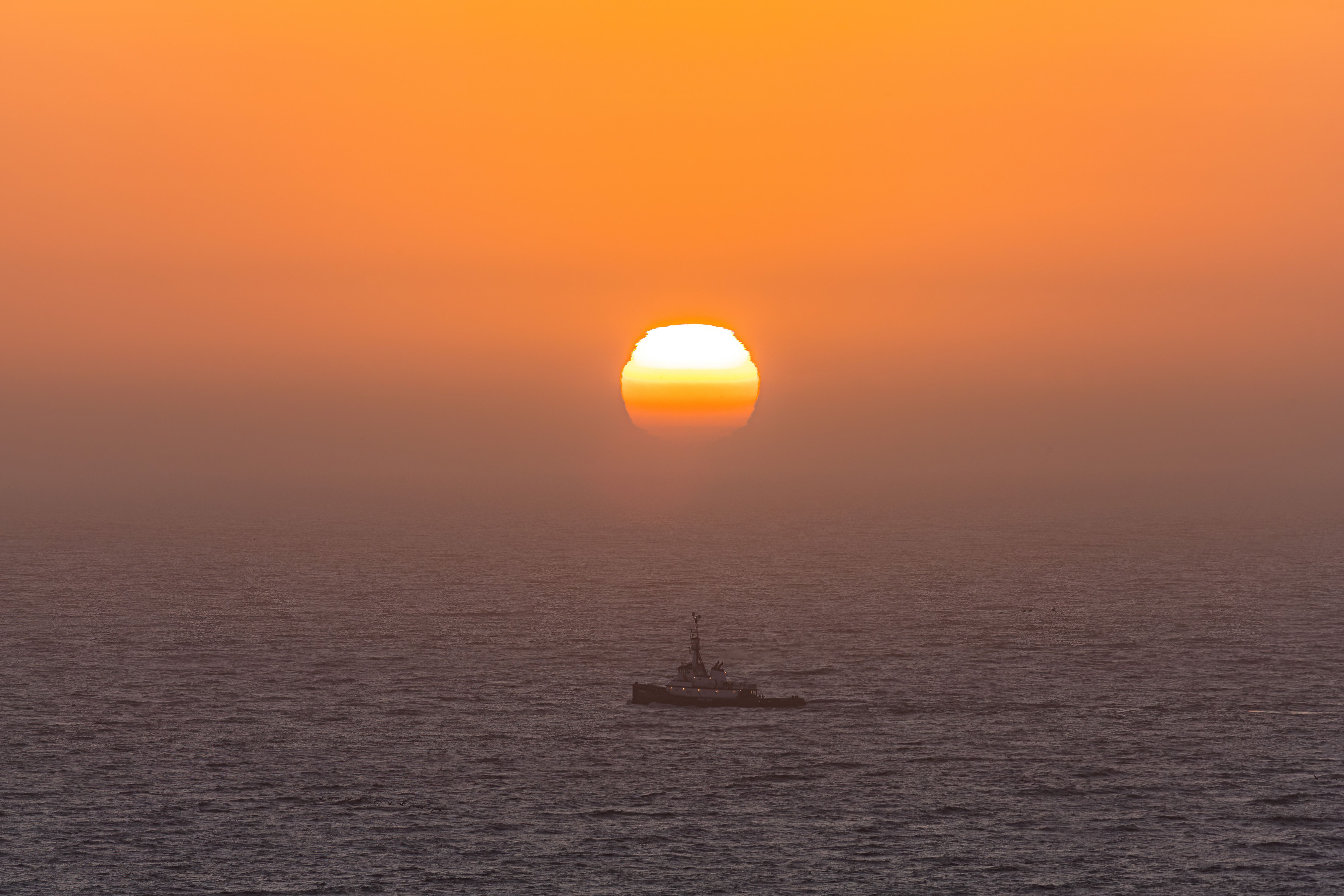 Silhouette of Ship on Sea during Sunset · Free Stock Photo