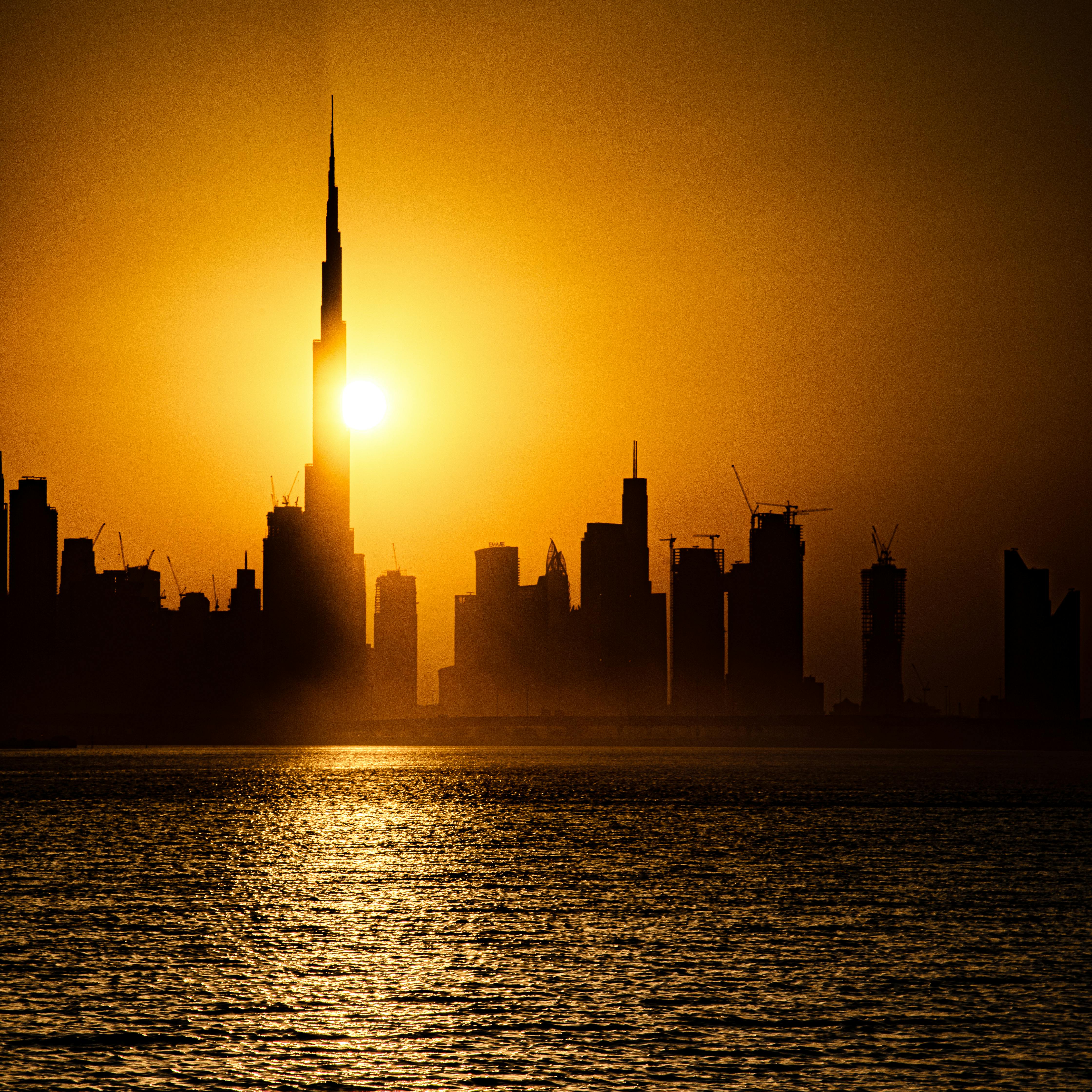 silhouette of city skyline during sunset