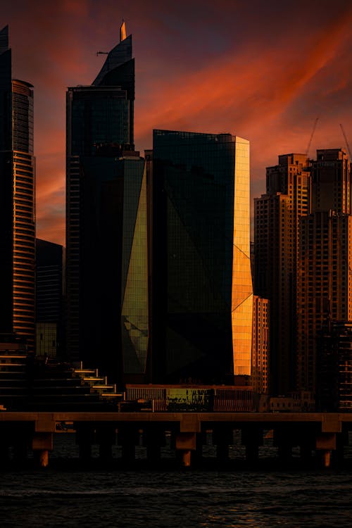 Kostnadsfri bild av dramatisk himmel, skyskrapor, solnedgång