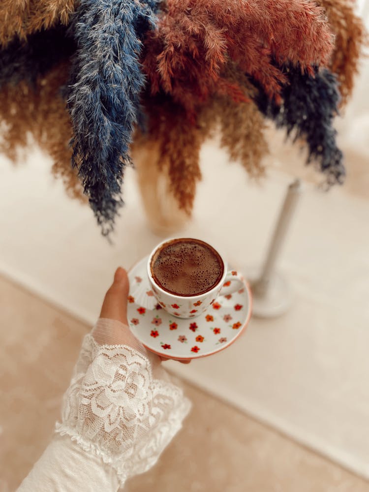 Woman Holding A Coffee Cup 