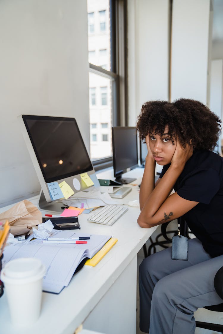 Bored Woman At An Office Desk