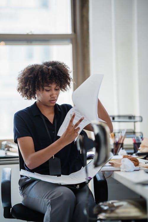 Woman Working With Documents in Office · Free Stock Photo