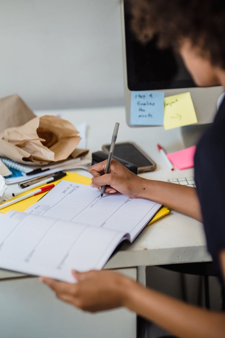 Woman Noting In Calendar