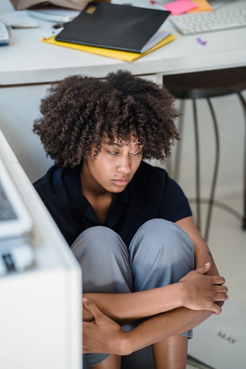 Stressed Depressed Office Worker Sitting on Office Floor