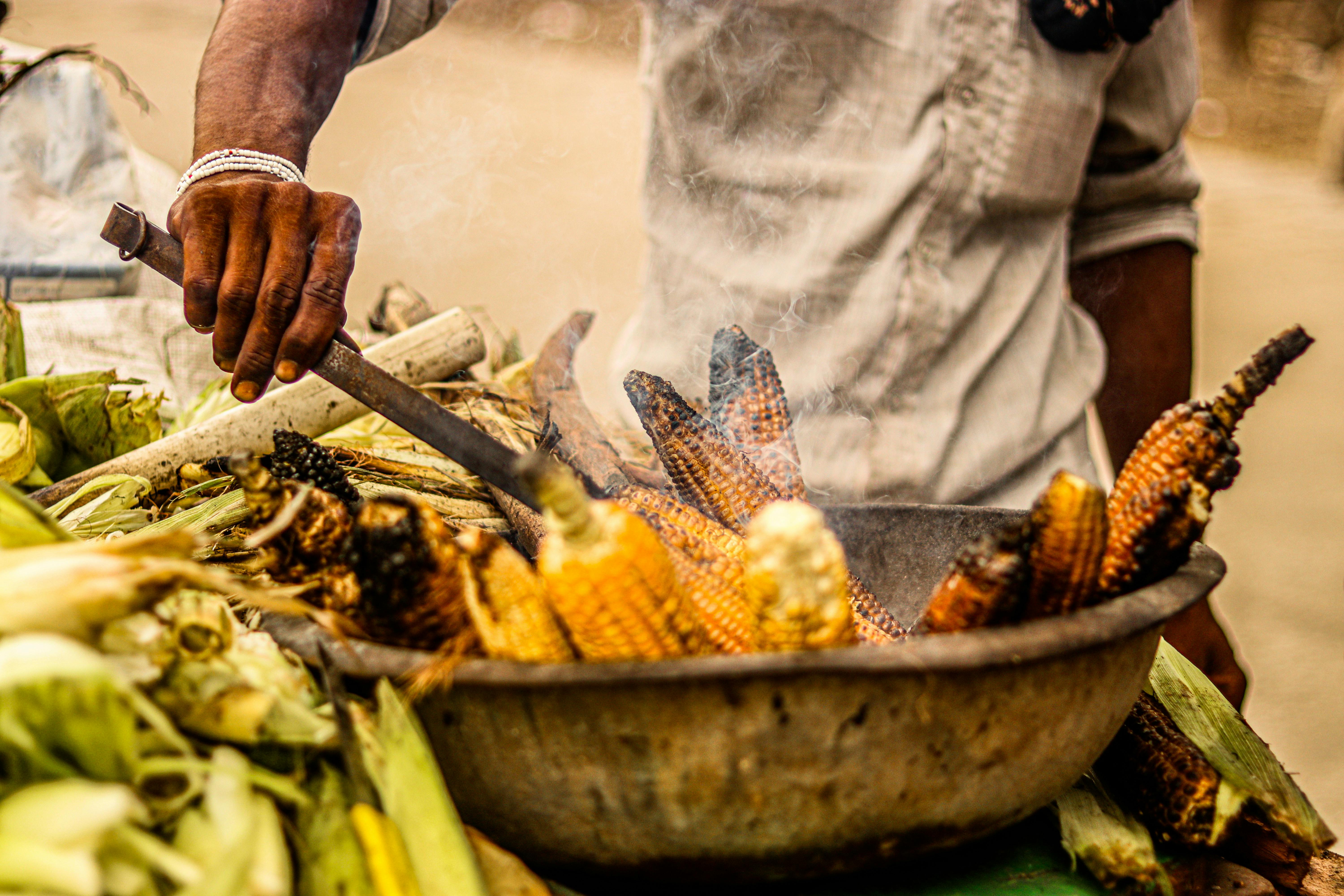 a close up shot of corn being grilled