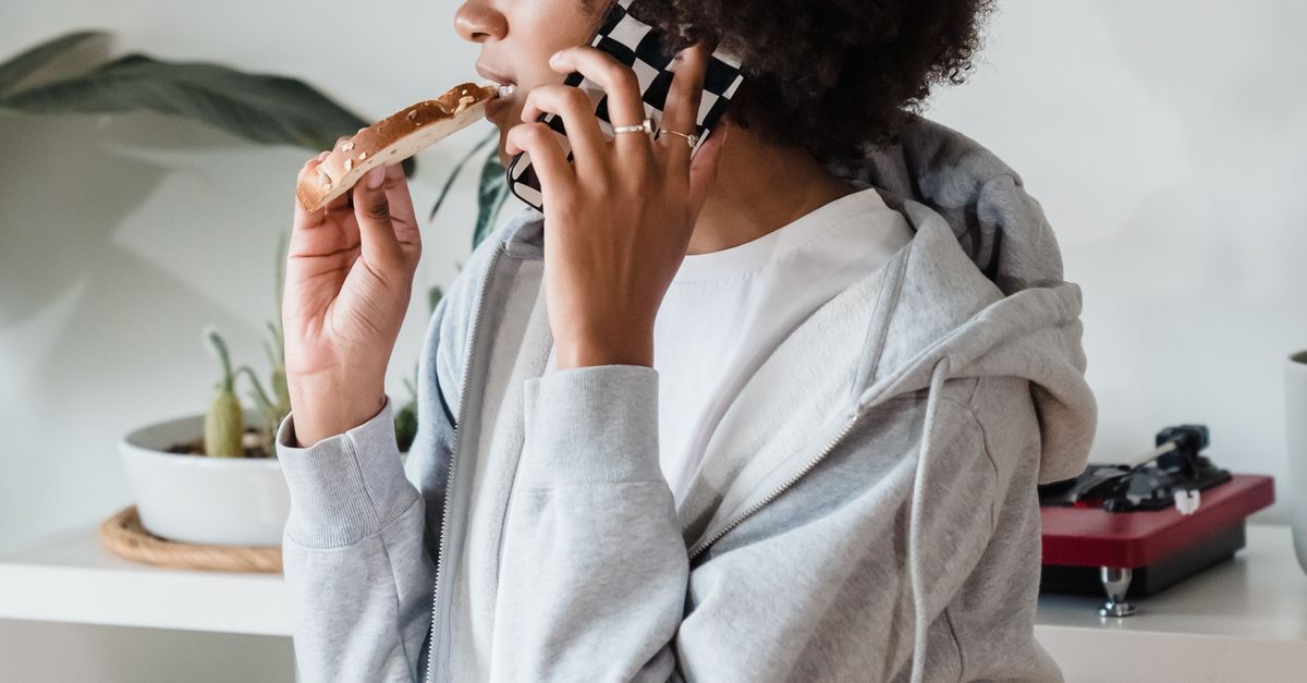 Woman Eating Toast Talking on Phone Β· Free Stock Photo