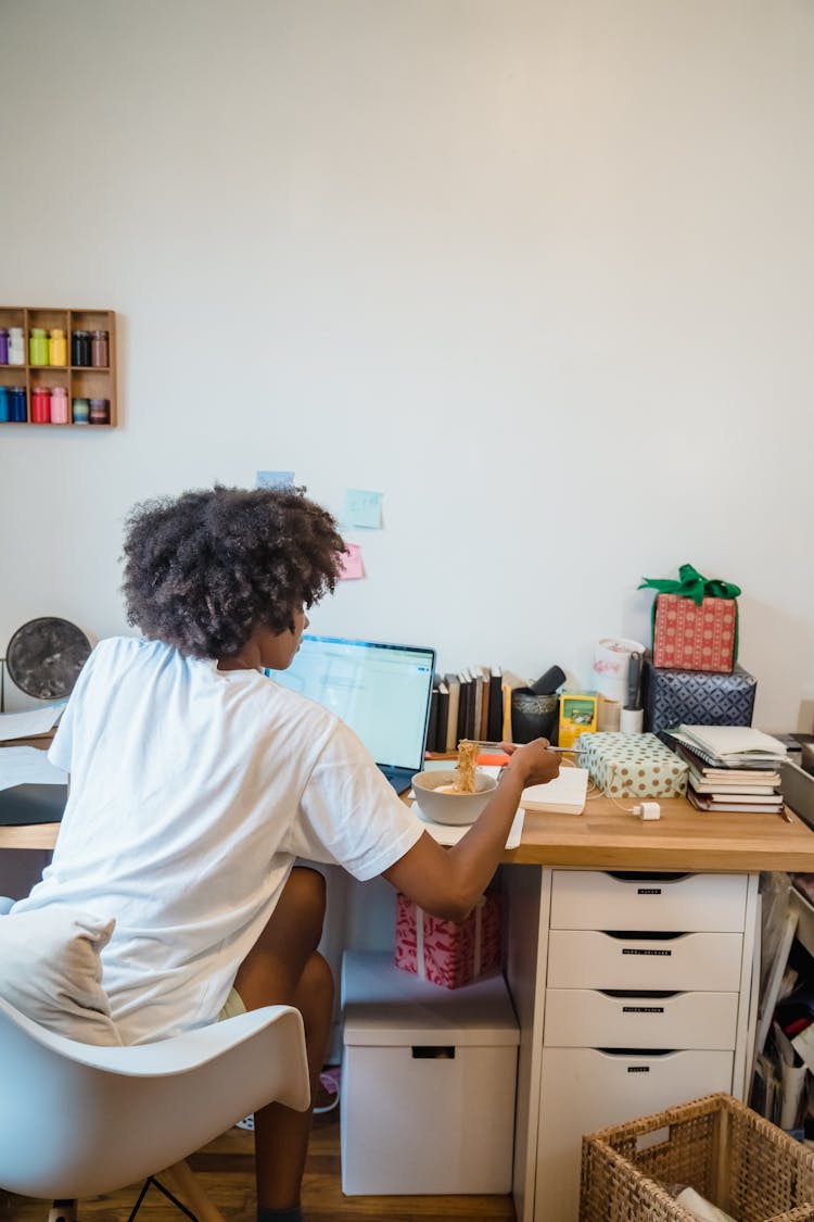 Woman Having Lunch While Working From Home