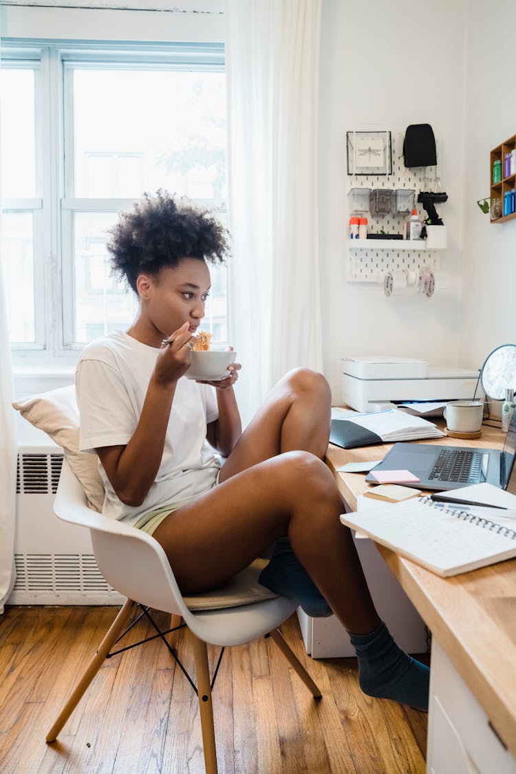 Woman Eating On Chair